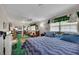 Spacious bedroom with a ceiling fan, natural light, and a blue-themed bed at 4164 Weston Dr, Powder Springs, GA 30127