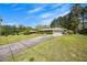 Spacious front yard with a long driveway leading to a well-maintained brick home at 4164 Weston Dr, Powder Springs, GA 30127
