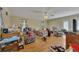 Open living room featuring wood flooring, windows, and a ceiling fan at 4164 Weston Dr, Powder Springs, GA 30127