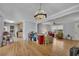 Open-concept living room with hardwood floors, connecting to the kitchen and dining area, ideal for entertaining at 4164 Weston Dr, Powder Springs, GA 30127