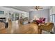 Spacious living room with hardwood floors, fireplace, ceiling fan, and sliding doors to the outdoors at 4164 Weston Dr, Powder Springs, GA 30127