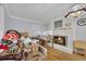 Bright living room featuring a cozy fireplace and hardwood floors perfect for relaxation and entertainment at 4164 Weston Dr, Powder Springs, GA 30127