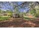 Wooded backyard area with two storage sheds at 4164 Weston Dr, Powder Springs, GA 30127