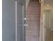 Entryway featuring stairs, a gray front door, and wood-look flooring at 148 Werner Brook Sw Way, Atlanta, GA 30354
