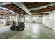 Unfinished basement, great for storage, featuring exposed ductwork and concrete floors at 2307 Woodridge Dr, Marietta, GA 30066