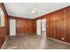 Spacious wood paneled bedroom with ceiling fan, offers great potential for a relaxing and inviting atmosphere at 2307 Woodridge Dr, Marietta, GA 30066