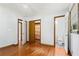 Bedroom with hardwood floors, closet, and view of the toilet and shower in en-suite bathroom at 2307 Woodridge Dr, Marietta, GA 30066