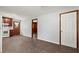 Bright living room with updated flooring flows into the kitchen, featuring a white oven and wood cabinets at 2307 Woodridge Dr, Marietta, GA 30066
