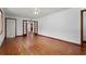 Spacious living room featuring hardwood floors and double doors to the kitchen at 2307 Woodridge Dr, Marietta, GA 30066