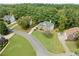 An aerial view showcases the lush landscaping and well-maintained homes in a desirable neighborhood at 374 Meadowmeade Cv, Lawrenceville, GA 30043