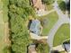 Aerial view of the property showcasing the well-maintained landscaping, trees, and neighborhood at 374 Meadowmeade Cv, Lawrenceville, GA 30043