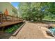 Expansive backyard with a patio, swing set, and stone pathway, perfect for outdoor activities and relaxation at 374 Meadowmeade Cv, Lawrenceville, GA 30043