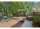 Serene backyard featuring a swing set, garden, and stone pathway, perfect for relaxation and outdoor activities at 374 Meadowmeade Cv, Lawrenceville, GA 30043