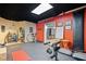 Basement gym with exercise equipment, rubber flooring, and motivational signage at 374 Meadowmeade Cv, Lawrenceville, GA 30043