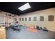Basement gym with weightlifting equipment, rubber flooring and motivational posters at 374 Meadowmeade Cv, Lawrenceville, GA 30043