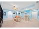Finished basement includes a recliner, table with chairs, white trim, light blue walls, and a ceiling fan at 374 Meadowmeade Cv, Lawrenceville, GA 30043