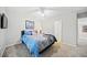 Bedroom featuring a comfortable bed, neutral walls, and natural light from a window at 374 Meadowmeade Cv, Lawrenceville, GA 30043