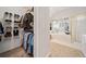 Walk-in closet with wire shelving and hanging rods, adjacent to a luxurious bathroom at 374 Meadowmeade Cv, Lawrenceville, GA 30043
