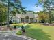 Charming community clubhouse with manicured landscaping and a welcoming entrance at 374 Meadowmeade Cv, Lawrenceville, GA 30043