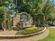 Stone-covered Edgewater community entrance sign, featuring a beautiful waterfall and landscaping at 374 Meadowmeade Cv, Lawrenceville, GA 30043
