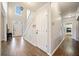 Bright foyer with hardwood floors, staircase, and a view into adjacent rooms, with plenty of natural light at 374 Meadowmeade Cv, Lawrenceville, GA 30043