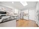Modern kitchen with stainless steel appliances, granite countertops, and hardwood flooring at 374 Meadowmeade Cv, Lawrenceville, GA 30043