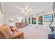 Open-concept living room with hardwood floors, large windows, and deck access at 374 Meadowmeade Cv, Lawrenceville, GA 30043