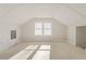 Bright attic space featuring neutral carpet, dormer windows, and versatile layout at 479 Shannon Sw Dr, Atlanta, GA 30310