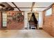 Quirky basement with brick walls, vintage accents, and curtained sleeping area at 479 Shannon Sw Dr, Atlanta, GA 30310