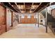 Exposed basement with exposed ductwork, brick walls, washer/dryer, and unique character at 479 Shannon Sw Dr, Atlanta, GA 30310