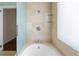 Bright bathroom featuring tile walls, glass shower door, and modern fixtures at 479 Shannon Sw Dr, Atlanta, GA 30310