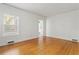 Bright bedroom with hardwood floors, large windows, and views of the kitchen at 479 Shannon Sw Dr, Atlanta, GA 30310