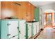 Bright kitchen with stainless steel appliances, tiled floor, and wood-paneled walls at 479 Shannon Sw Dr, Atlanta, GA 30310