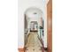 The kitchen is connected to the rest of the house through a vaulted archway and tiled floor at 479 Shannon Sw Dr, Atlanta, GA 30310