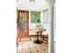 The kitchen nook features a wooden table and chairs, and large windows with lots of light at 479 Shannon Sw Dr, Atlanta, GA 30310
