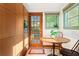 The cozy kitchen nook has a wooden table, chairs, and a large window for natural light at 479 Shannon Sw Dr, Atlanta, GA 30310
