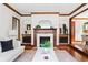 Elegant living room with a fireplace, hardwood floors, and stylish decor at 479 Shannon Sw Dr, Atlanta, GA 30310