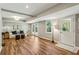 Finished basement with hardwood floors, recessed lighting, and walkout access to the yard at 550 Ambergate Ct, Roswell, GA 30076
