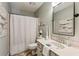 Cozy bathroom featuring a shower with curtain, modern vanity, and neutral decor at 550 Ambergate Ct, Roswell, GA 30076