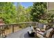 Relaxing outdoor deck features comfortable seating and a view of the lush greenery at 550 Ambergate Ct, Roswell, GA 30076