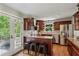This spacious kitchen features granite counters, stainless appliances, and a peninsula with seating at 550 Ambergate Ct, Roswell, GA 30076