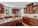Charming kitchen with granite counters, wood cabinets, and stainless-steel appliances at 550 Ambergate Ct, Roswell, GA 30076