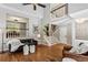 Spacious living room with hardwood floors, tall ceilings, and staircase at 550 Ambergate Ct, Roswell, GA 30076