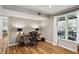 Bright home office with a large window, modern desk, and hardwood floors at 550 Ambergate Ct, Roswell, GA 30076