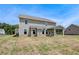 The spacious backyard features a covered porch, offering a serene outdoor living space at 119 Felicity Pike, Locust Grove, GA 30248