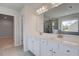 Bright bathroom featuring a soaking tub, glass shower, double vanity, and natural light at 119 Felicity Pike, Locust Grove, GA 30248