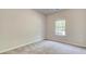 Cozy bedroom with neutral paint, carpet flooring and a bright window view at 119 Felicity Pike, Locust Grove, GA 30248
