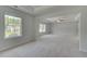A spacious bedroom with large windows and a ceiling fan for comfort at 119 Felicity Pike, Locust Grove, GA 30248