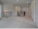 Upstairs hallway with carpeted floors and wrought iron railings at 119 Felicity Pike, Locust Grove, GA 30248