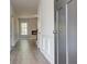 Long hallway showcasing durable floors and leading to living area with fireplace at 119 Felicity Pike, Locust Grove, GA 30248